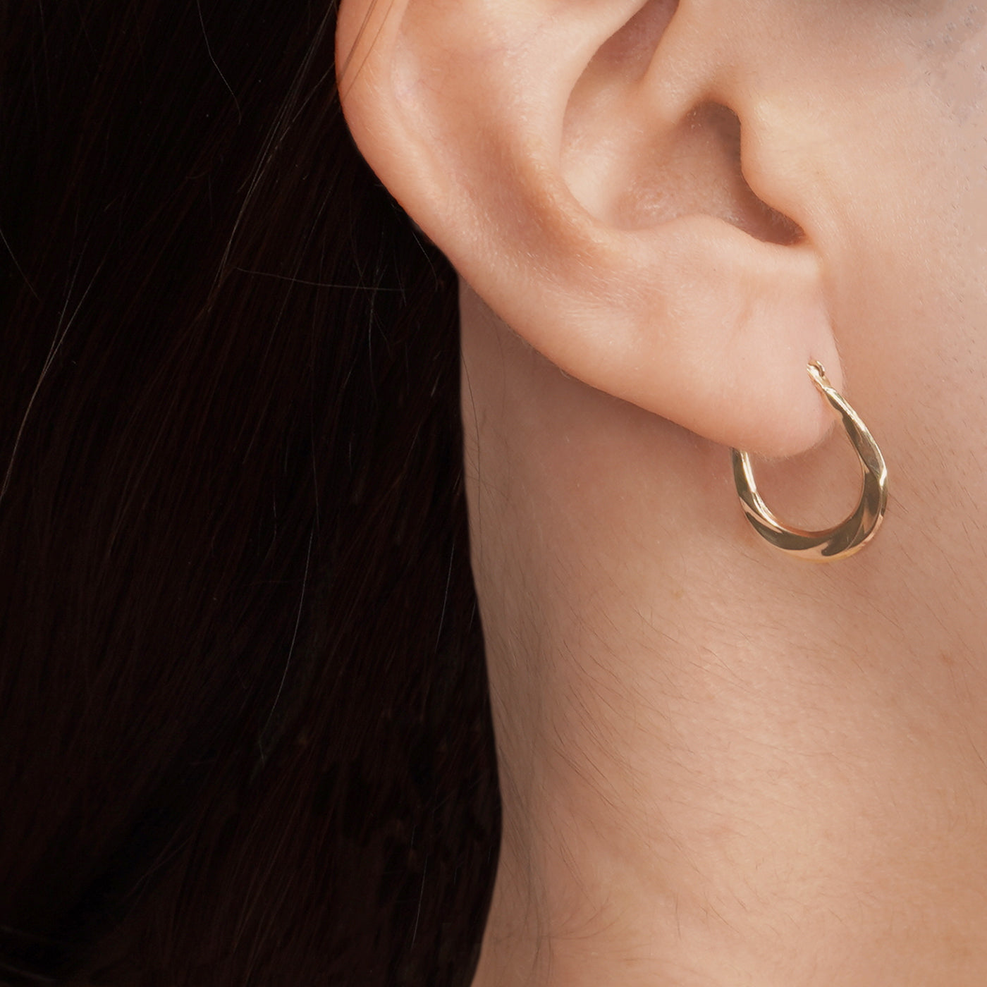 Solid Gold Twist Design Oval Shape Hoop Earrings