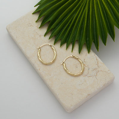 14K Gold Twisted Oval Diamond Cut Hoop Earrings