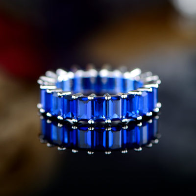 Blue Emerald Cut Silver Eternity Ring